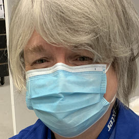 Baxter employee masked up who is volunteering at a COVID-19 vaccine clinic