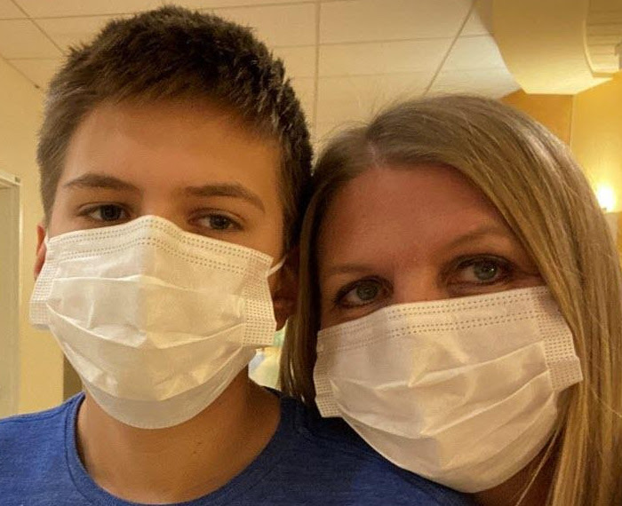 Jake and his mother Danielle in face masks