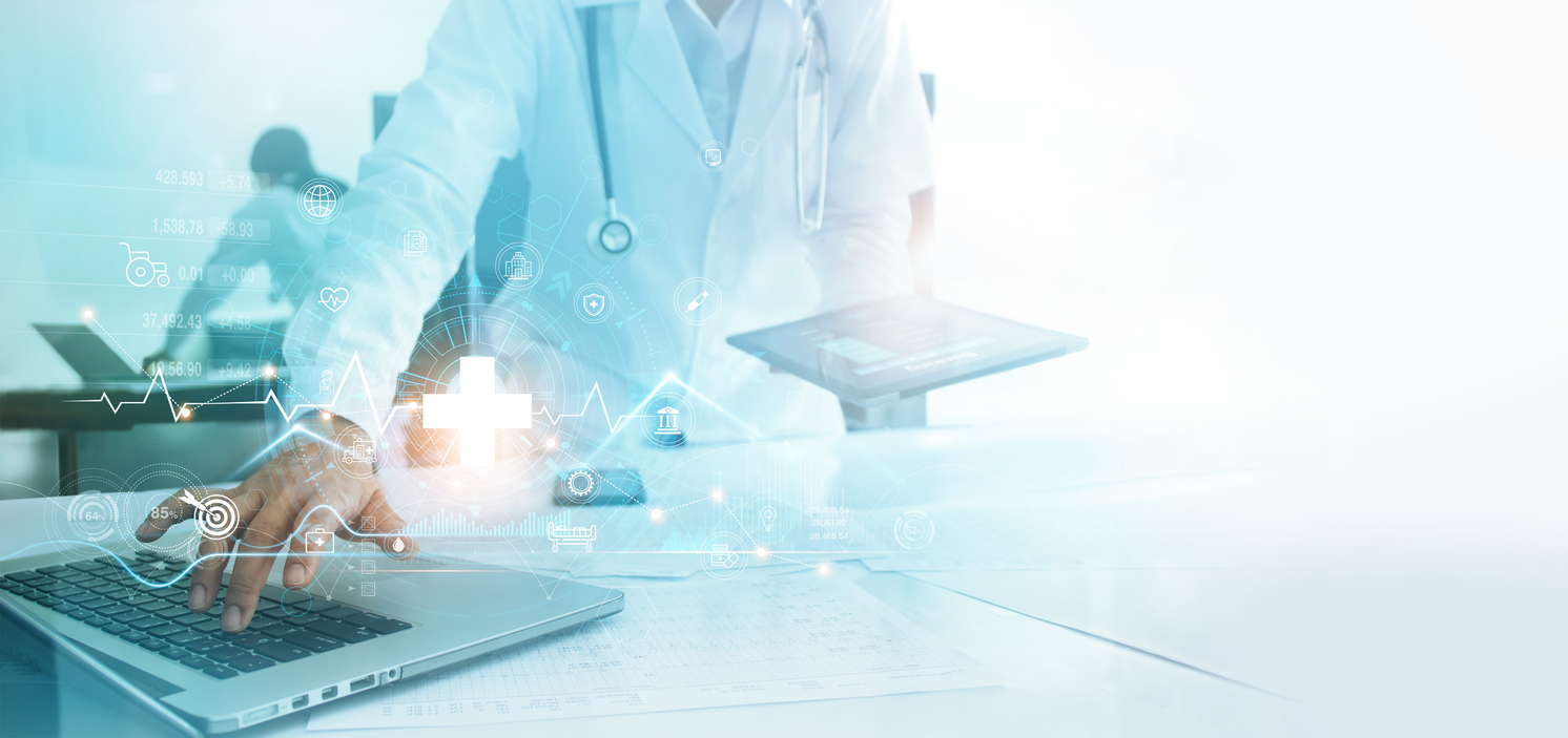 clinician using computer with technology graphics in the background