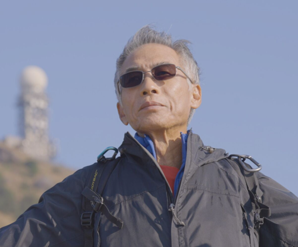 Man standing outside wearing sunglasses