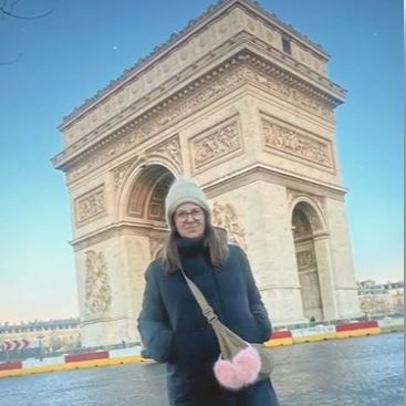 Patient standing in front of a monument