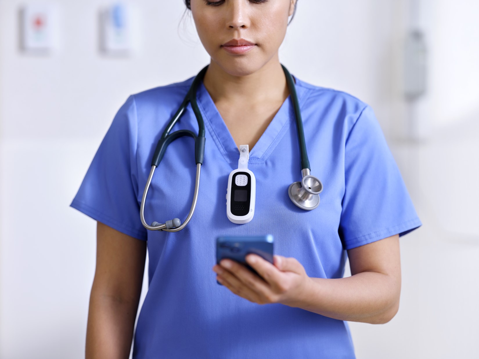 Nurse holding a mobile device