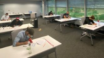 Students sitting at desks taking a test