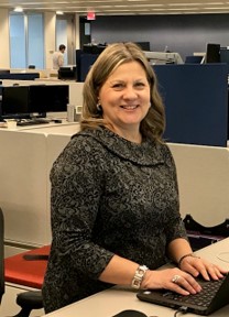 Image of Laura Angelini working at a desk