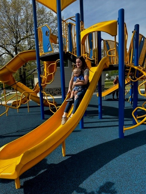 Nicklaus on a slide with his mother, Kayla