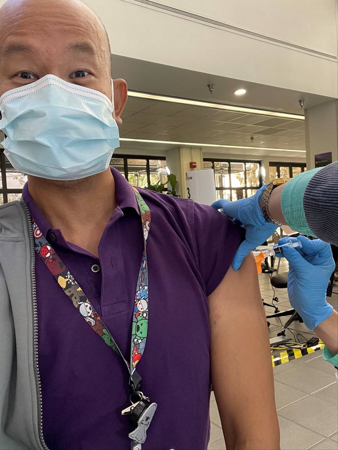 Nephrologist receives a vaccine shot