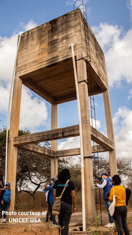 water tower rises toward the sky