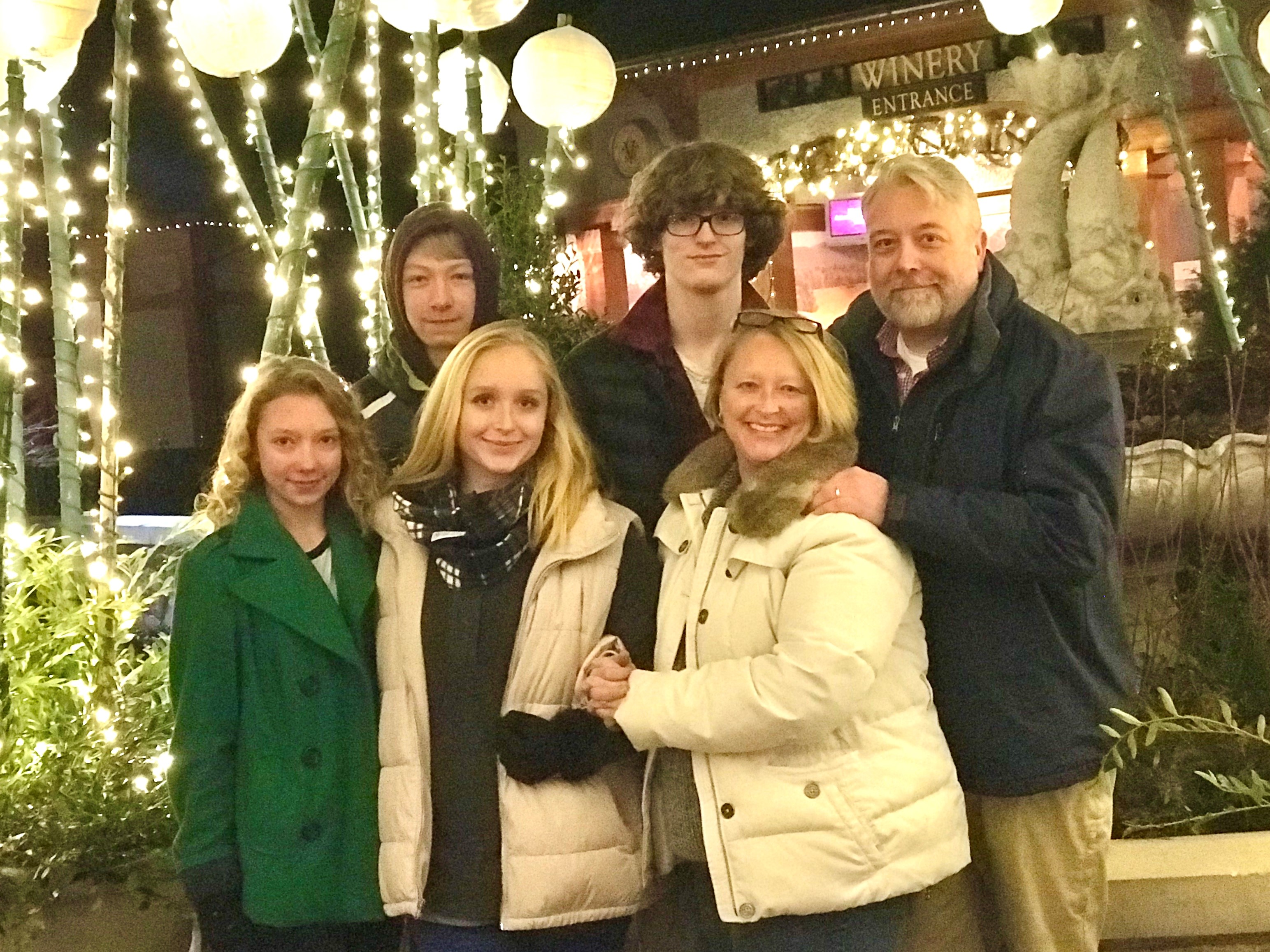 Baxter employee with his family at a holiday market