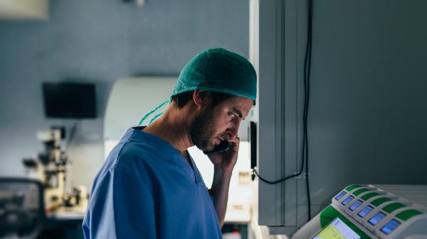 Physician in a lab on the phone