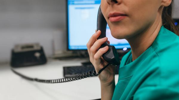 Image of hospital employee using the phone