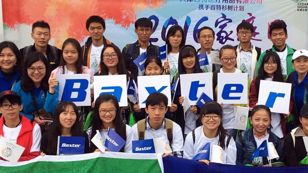 Students holding Baxter Flags