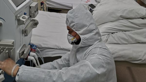 Image of a technician servicing medical equipment