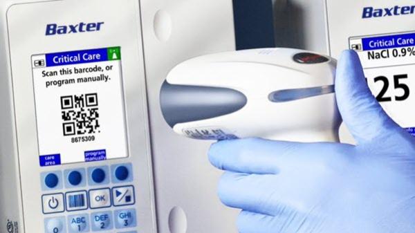 A healthcare provider scans a QR code on a medical device