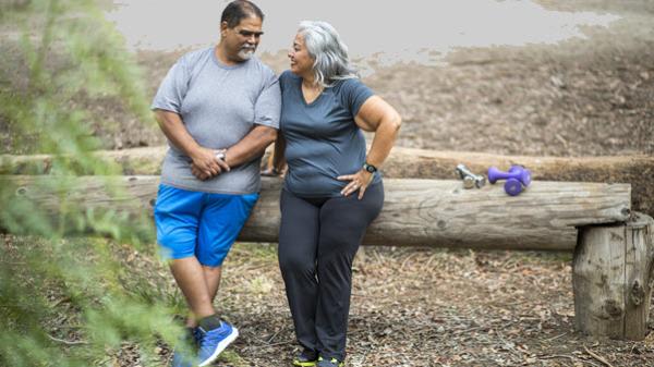 A couple takes a break from exercising