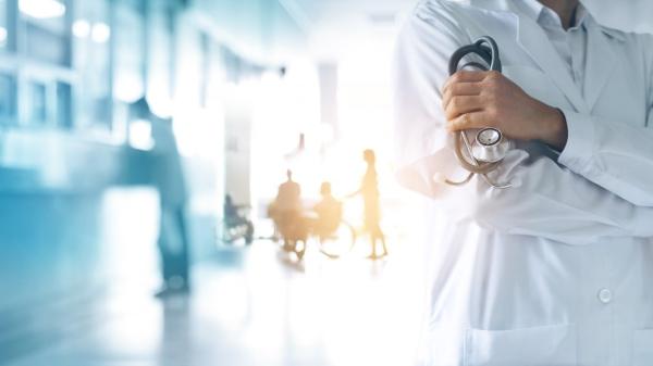 Physician standing in a hospital hallway