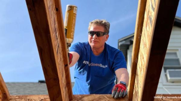 Baxter volunteer works on building a home