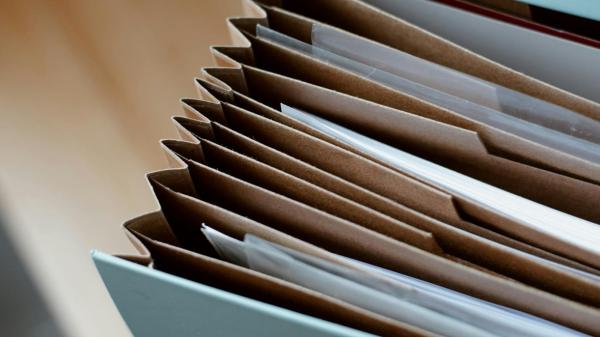 Opened folder for documents on table