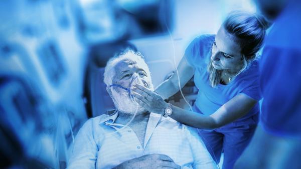 Patient receiving treatment in ambulance