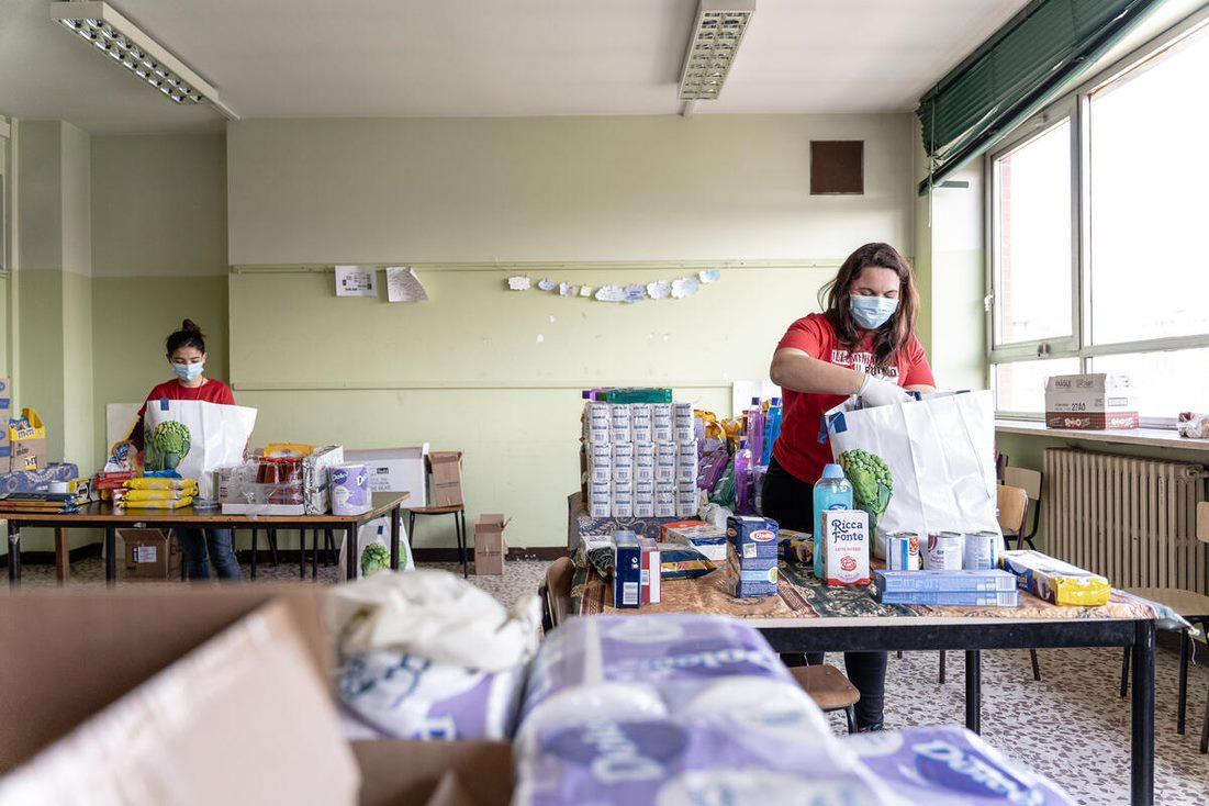 Image of volunteers packing care kits for Save The Children.