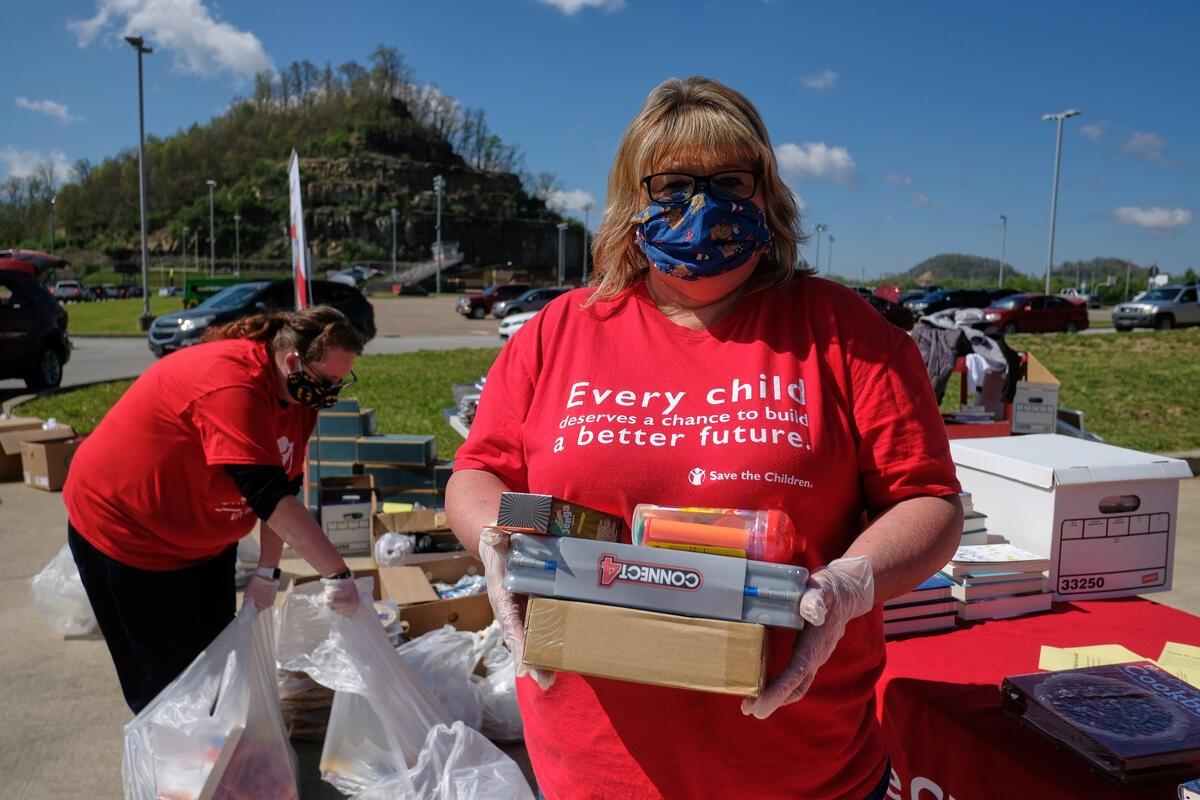 Image of volunteers packing care kits for Save The Children.