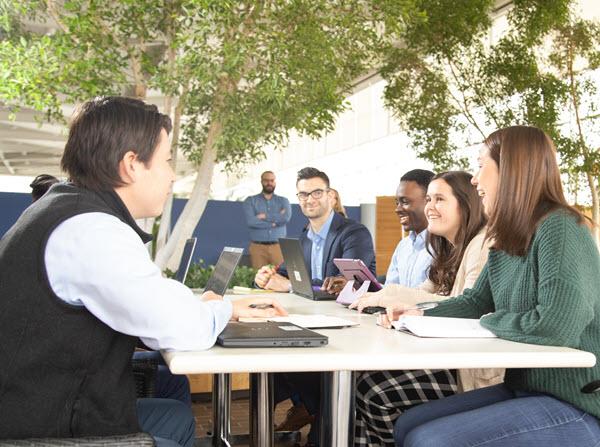 Image of employees engaged in a conversation