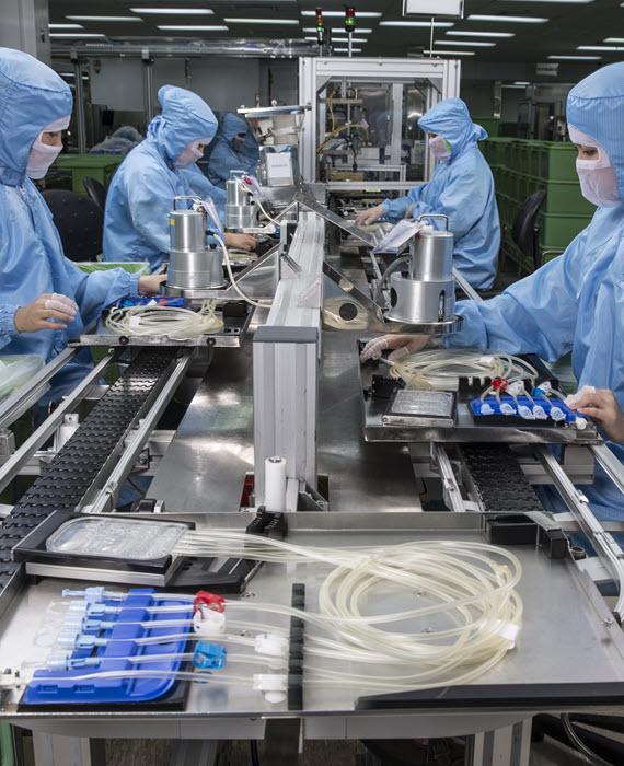 employees working on a manufacturing line