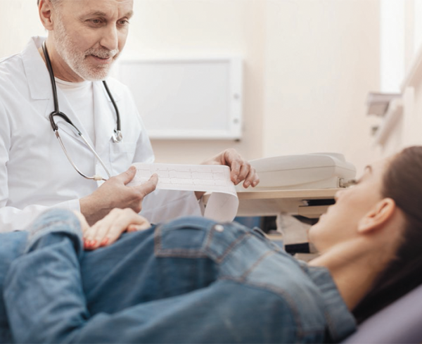 Healthcare professional going over test results with a patient