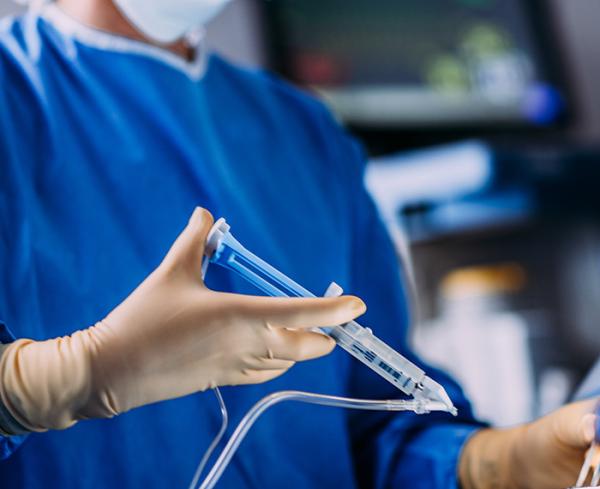 Surgeon administers a surgical sealant 