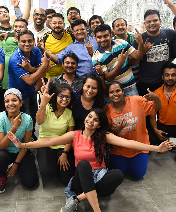 Baxter employees huddle together for a fun photo op