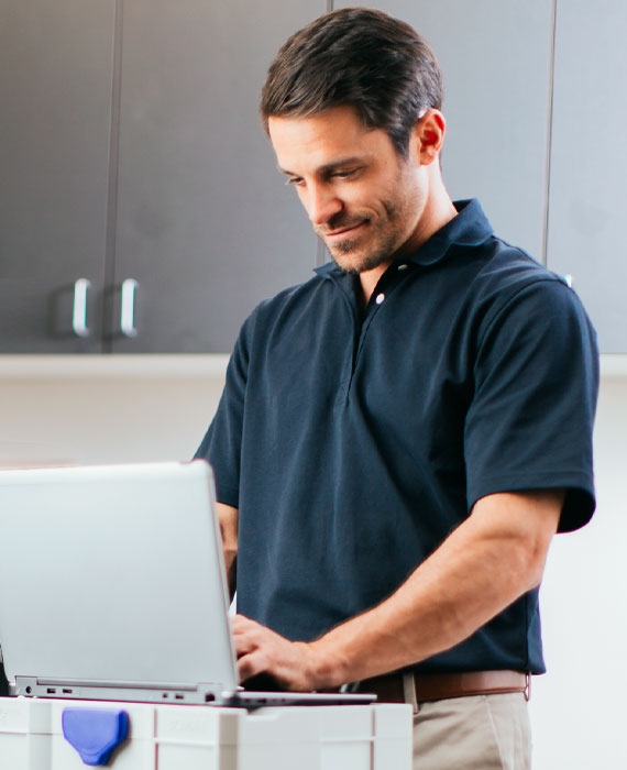 An employee works on his computer