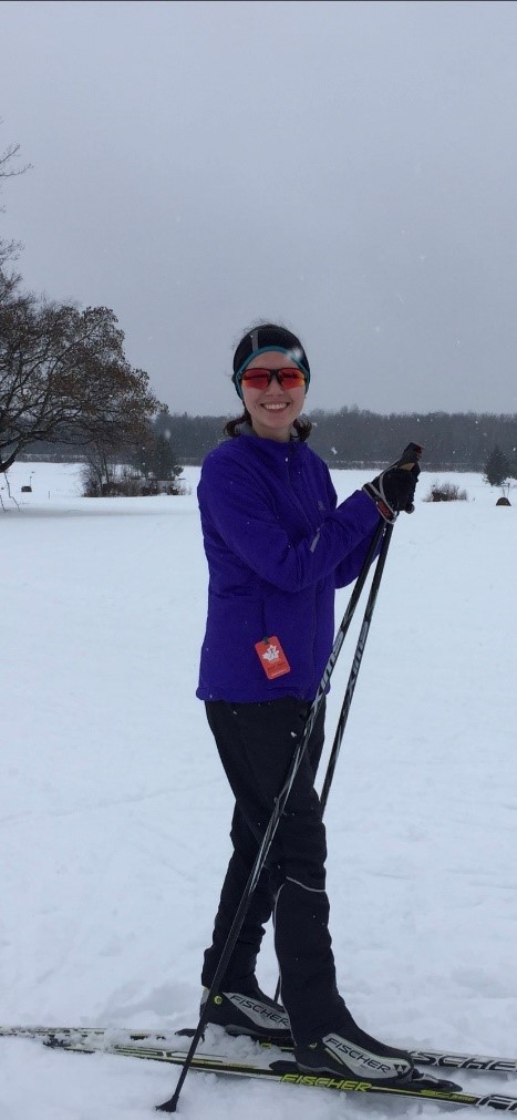 A young women uses her cross country skis