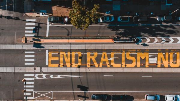 End racism message painted on a street