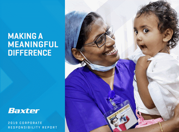 Image of a healthcare provider holding a young child in a hospital gown.
